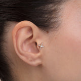 ear model wearing 14k gold baguette cz tragus earring cartilage piercing