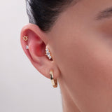 14K gold triple cartilage earring stack with hexagram, teardrop and cluster studs – stylish multi-piercing ear styling with minimalist hoop.