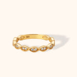 14K yellow gold ring with marquise-shaped links and small sparkling diamonds