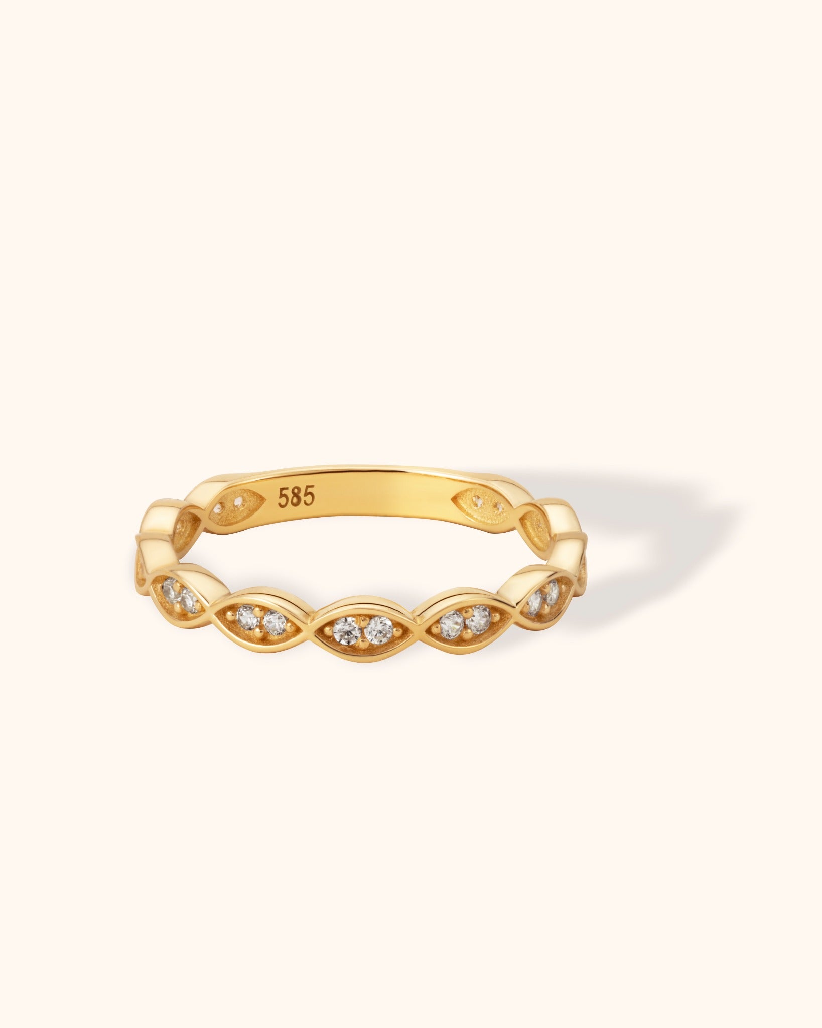 14K yellow gold ring with marquise-shaped links and small sparkling diamonds