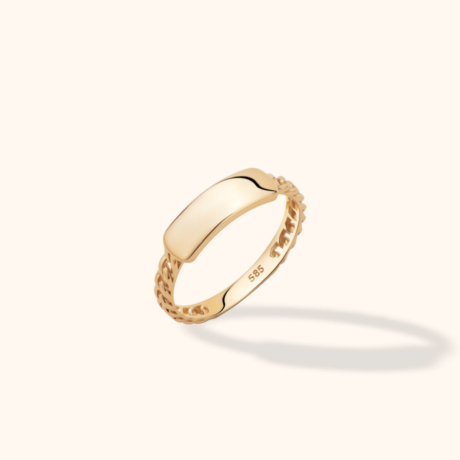 Gold-colored ring with a smooth, curved rectangular plate, chain-link sides and a visible 585 stamp inside the band.