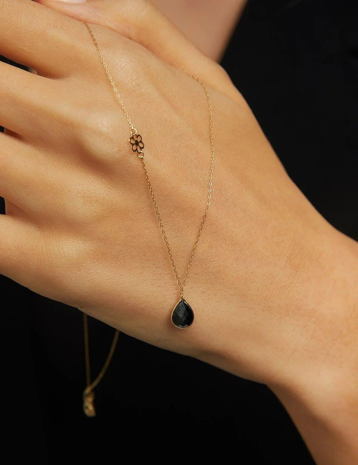 Elegant 14K gold necklace with black onyx teardrop pendant