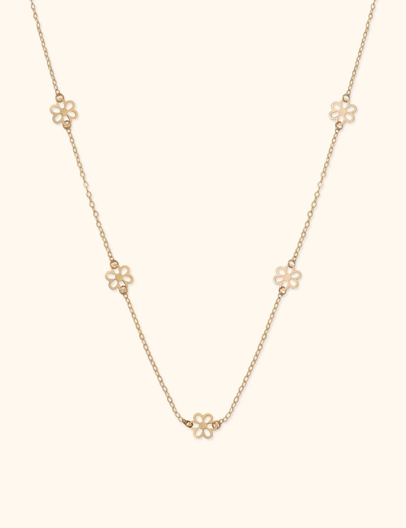 14K gold necklace with open flower station charms evenly spaced on delicate chain