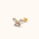 Gold-tone stud earring with three clear rectangular stones in a geometric cluster, a straight post and a flat round back.
