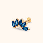 Gold-toned stud earring with five blue marquise-shaped stones in a curved leaf-like cluster, a straight post and flat round back.