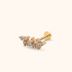 Gold-colored stud earring with two staggered rows of round clear stones, a straight post and a flat circular back.