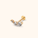 Gold-toned piercing stud with three clear round stones in increasing sizes, a straight post and a flat circular back.