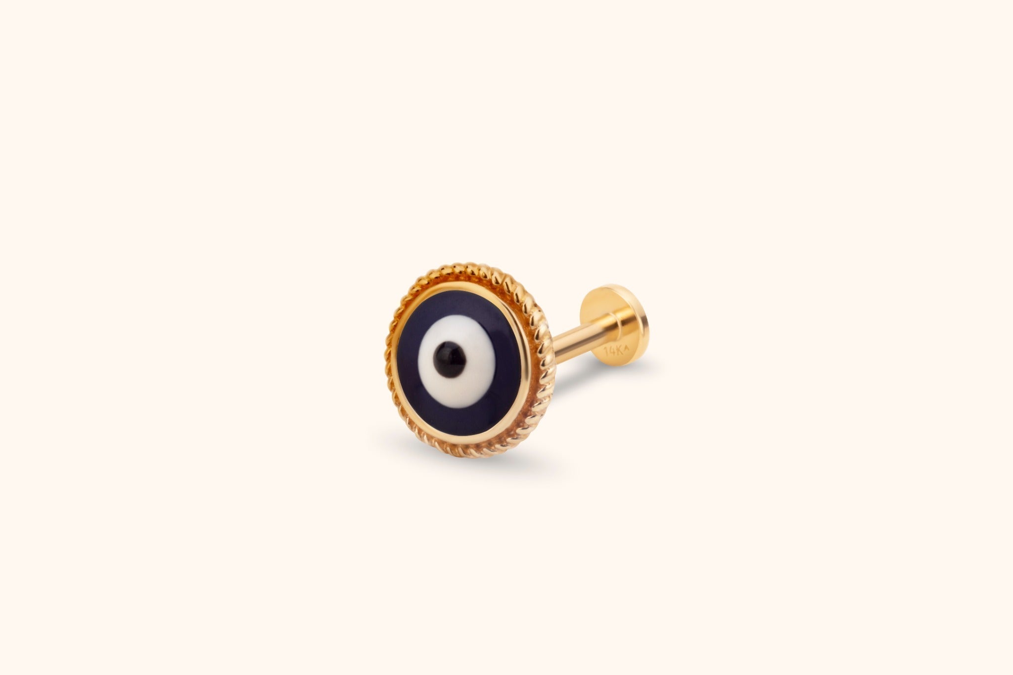 Gold-toned piercing stud with a round navy, white and black evil eye, twisted rope border and flat disc backing.