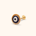Gold-toned piercing stud with a round navy, white and black evil eye, twisted rope border and flat disc backing.