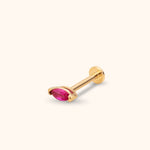 Gold-tone piercing stud with a faceted pink marquise-shaped stone, straight post and flat round back on a cream background.