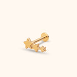 Gold-colored stud earring with three connected stars in decreasing sizes, a straight post and a flat round back.