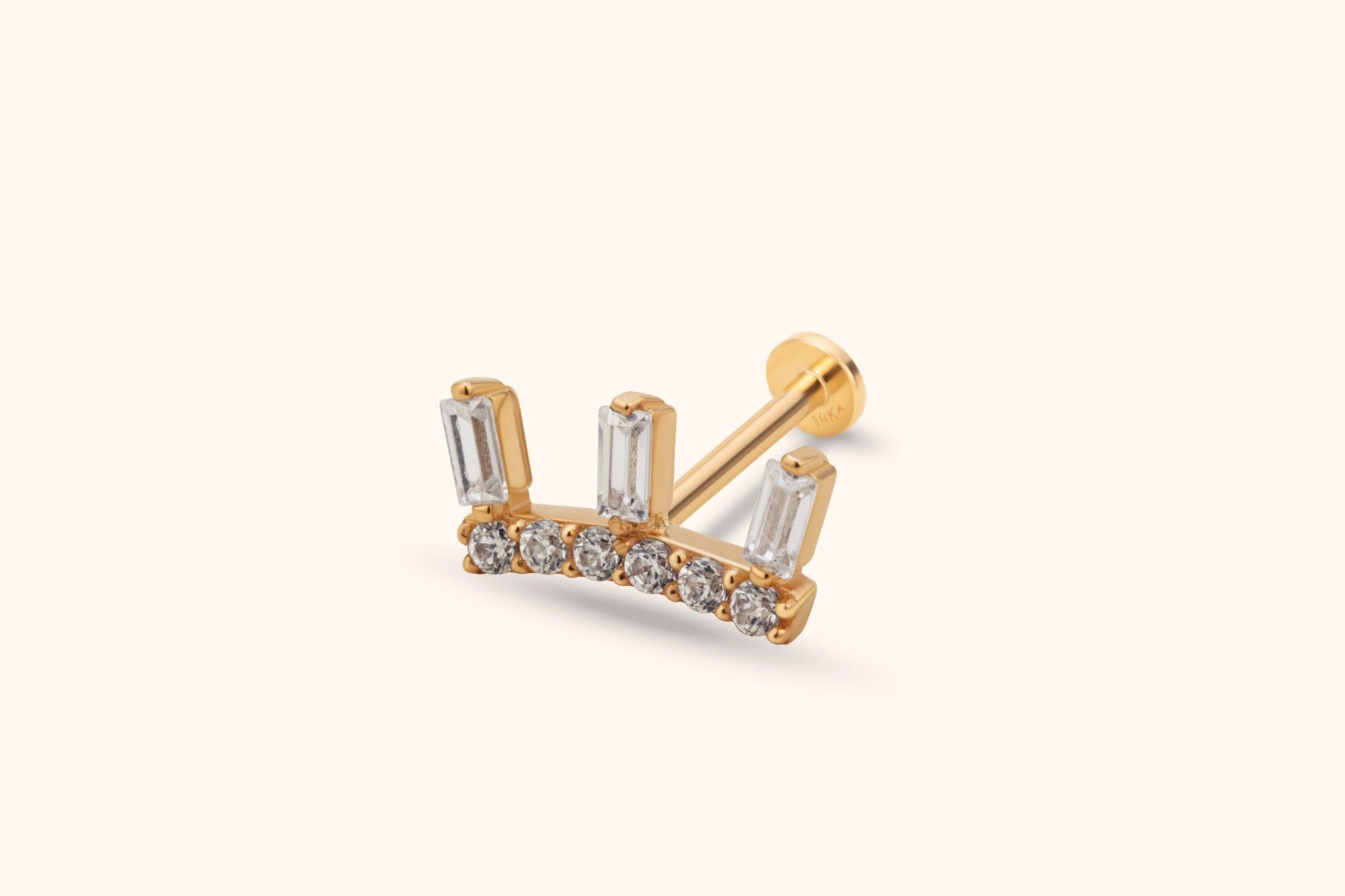 Gold-toned crown-shaped stud with three clear rectangular accents above six round accents, a straight post and flat disc back.