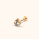 Gold-toned stud earring with a clear teardrop-shaped faceted stone, smooth bezel setting, straight post and flat round back.