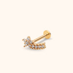 Gold-toned stud earring with a clear stone cluster, curved row of round clear stones, straight post and flat disc back.