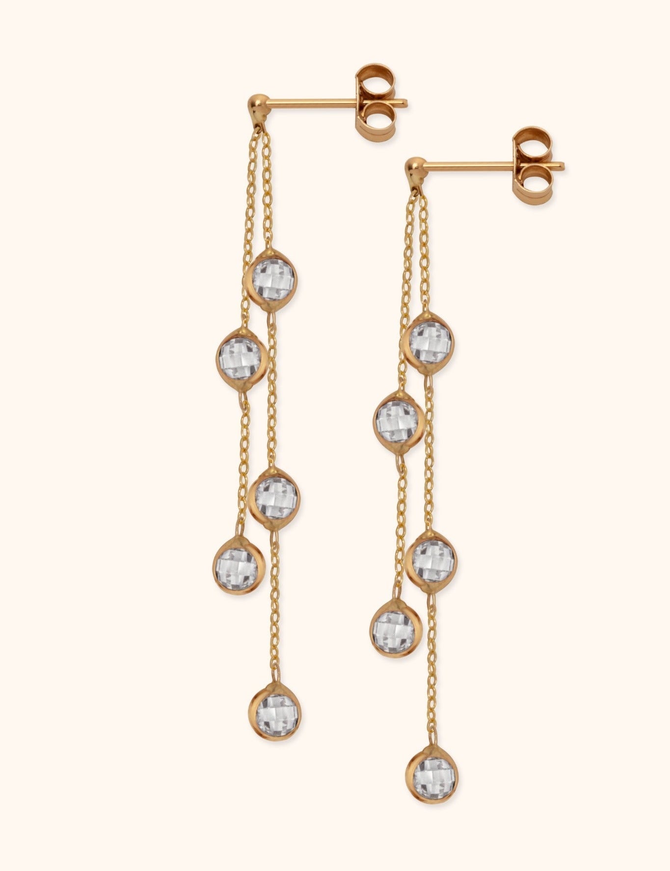 Pair of gold-tone drop earrings, each with two fine chains, five round clear faceted charms, and butterfly backs.