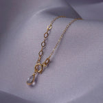 14K gold necklace featuring multiple four-leaf clover charms,