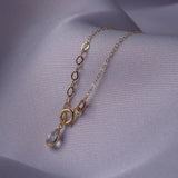 14K gold necklace featuring multiple four-leaf clover charms,