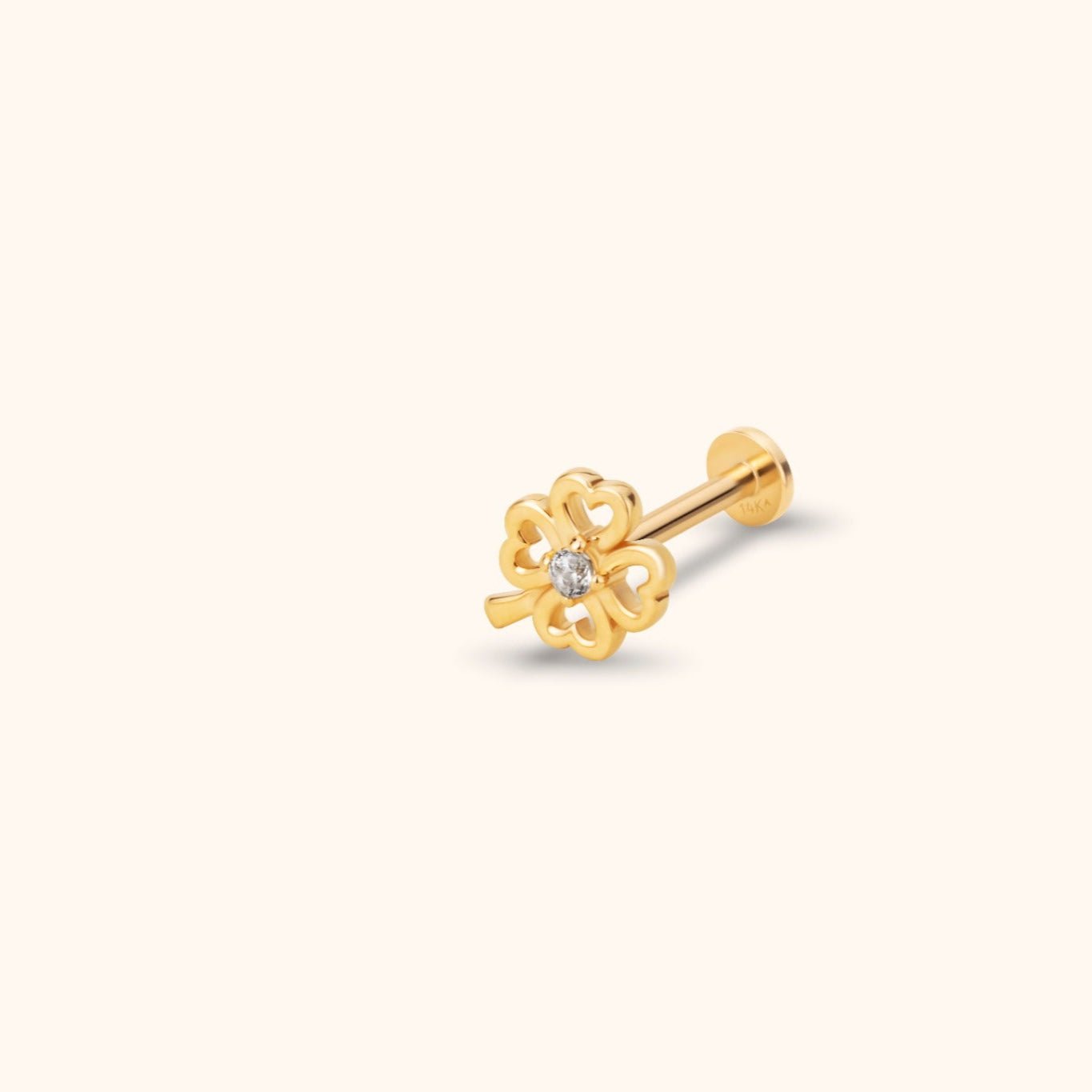 Gold-colored clover stud earring with four open heart-shaped leaves, a clear center accent, and a flat round back.