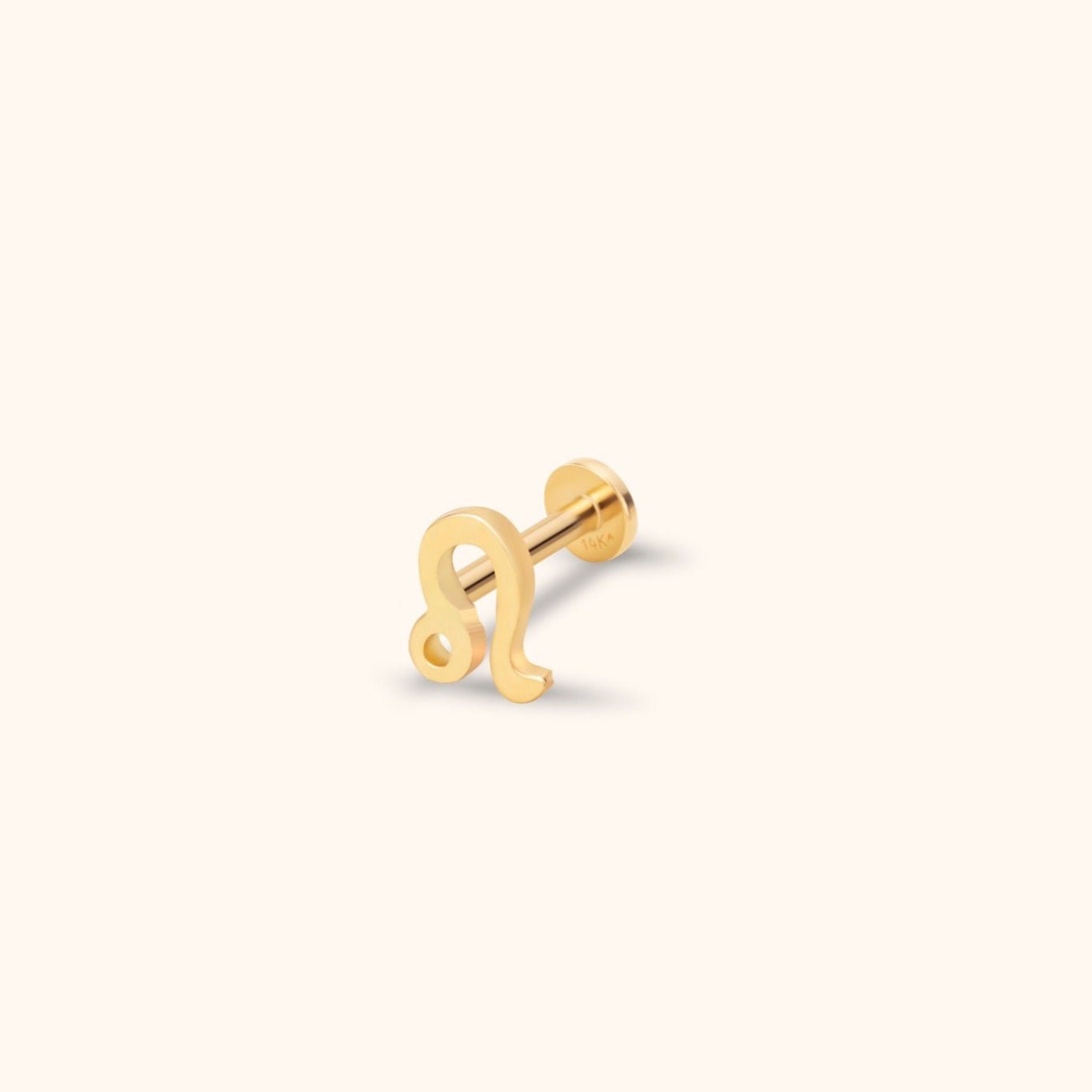 Gold-colored Leo zodiac stud with a straight post and round flat back, shown at an angle on a cream background.