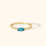 Minimalist 14K gold ring with marquise cut blue topaz gemstone