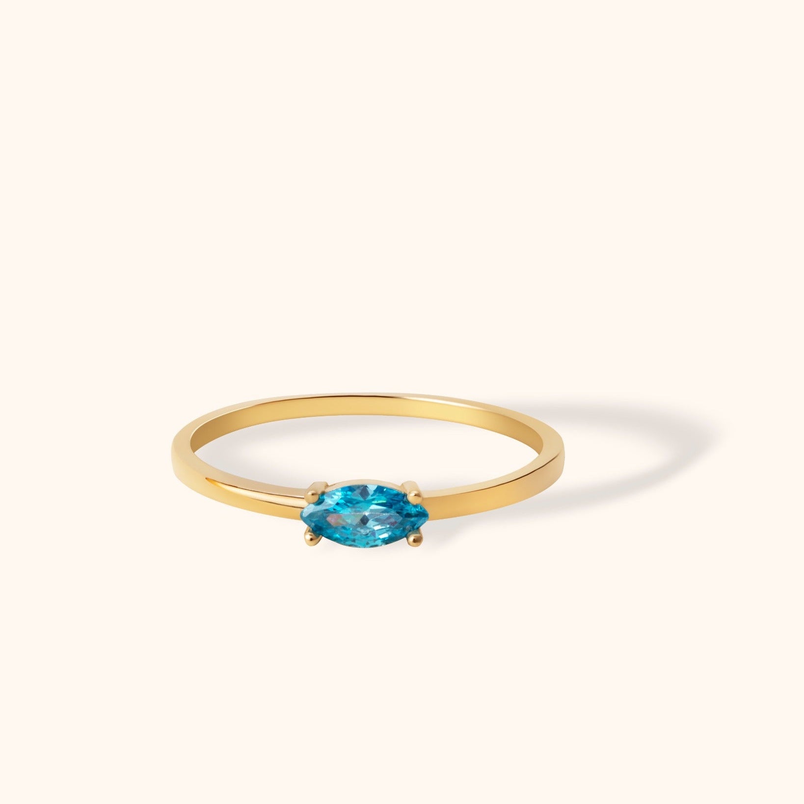 Minimalist 14K gold ring with marquise cut blue topaz gemstone