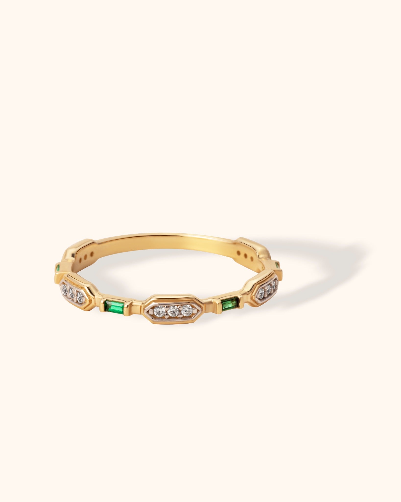14K gold band with emerald baguette and diamond pavé accents in geometric art deco style