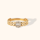14K gold ring with faceted band and center cluster of baguette and round diamonds