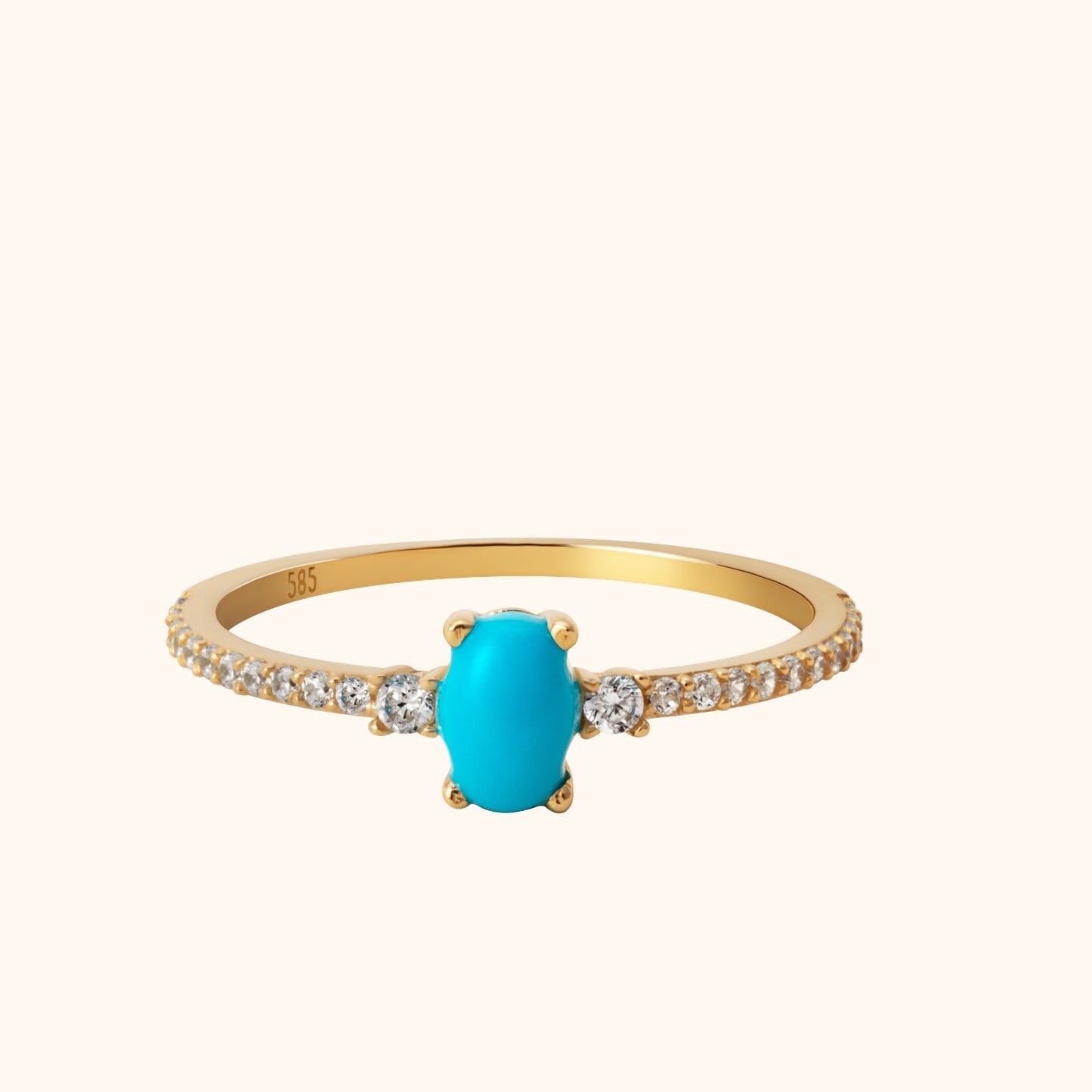 14K gold ring with oval turquoise center stone and pavé diamond band