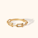 Minimalist 14K yellow gold ring featuring polished link chain design with modern round accents