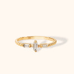 14K gold ring with beaded band and three vertical-set baguette-cut white stones