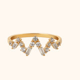 14K gold chevron ring featuring round and baguette-cut diamonds in a crown-like design