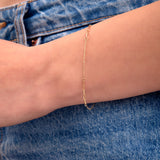 Wear it with the matching Paperclip Necklace and Mini Gold Hoops for a cohesive golden look that works from day to night.

