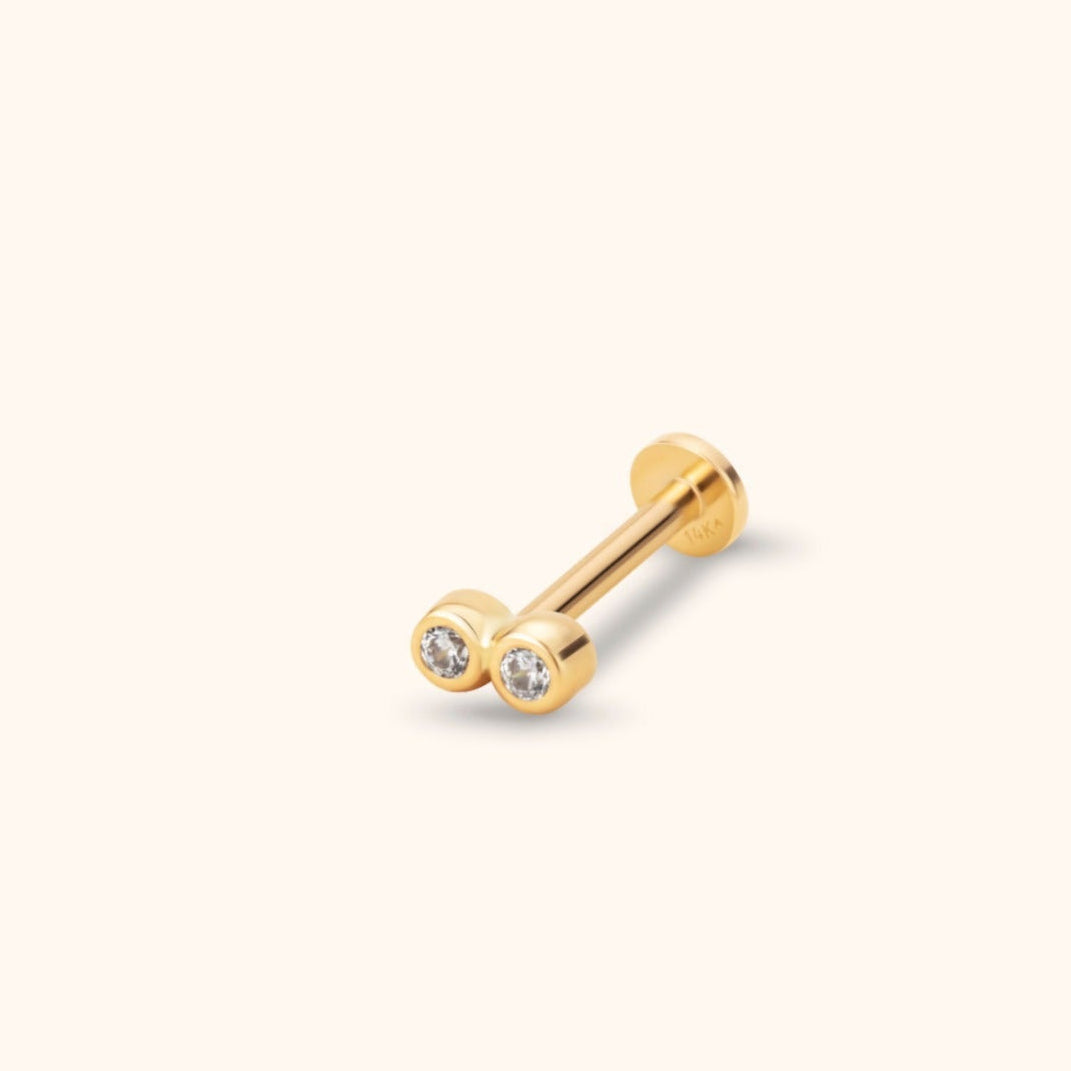 Minimalist 14K solid gold tragus stud earring with two bezel-set clear gemstones