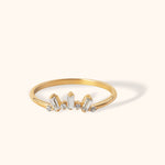 Elegant 14k gold ring featuring five baguette-cut diamonds in a modern, minimalistic design