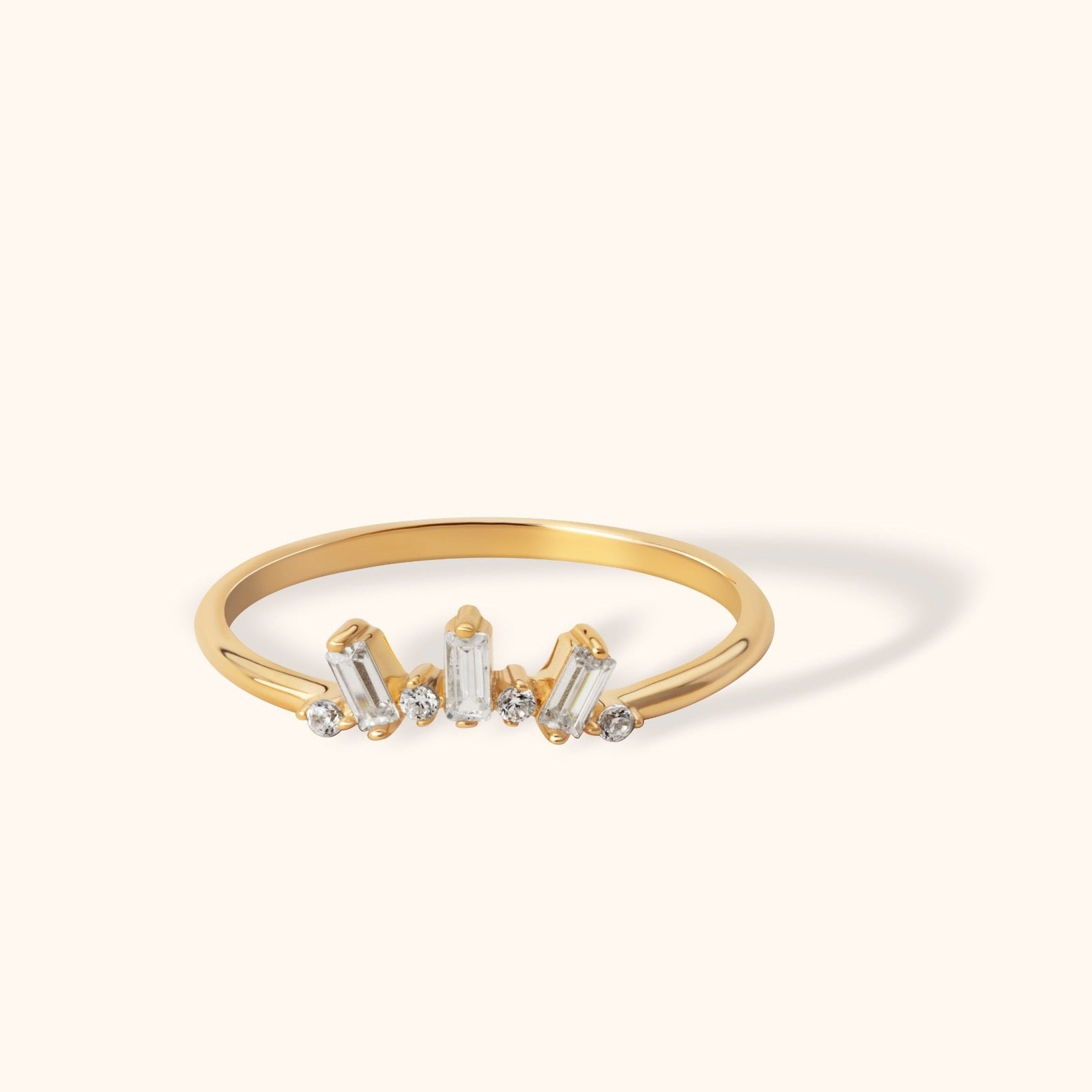 Elegant 14k gold ring featuring five baguette-cut diamonds in a modern, minimalistic design