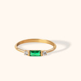 14K gold ring with baguette-cut green emerald and side diamonds
