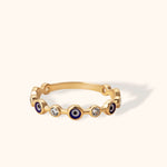 14K gold band with alternating evil eye enamel charms and round-cut diamonds