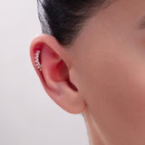 Curved gold helix piercing with baguette-cut zircon crystals – stylish cartilage cuff