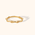 14K gold bamboo-textured ring with rounded segmented design, minimalist nature-inspired band