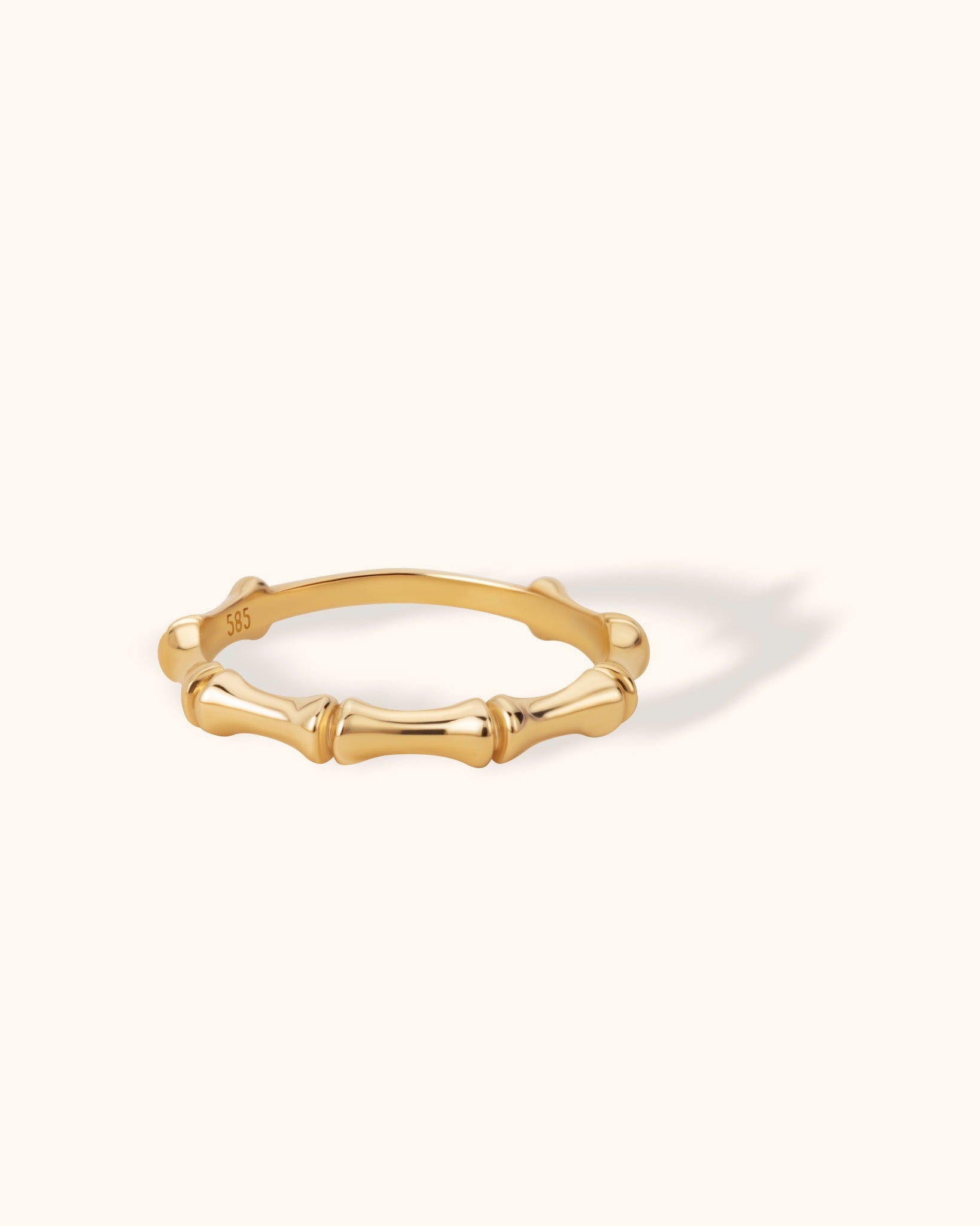 14K gold bamboo-textured ring with rounded segmented design, minimalist nature-inspired band