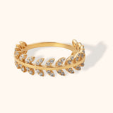 14K gold ring featuring laurel leaf design with diamond detailing