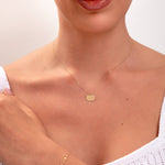 model showing complete gold set – necklace, bracelet, and hoops

