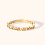 14K gold ring with infinity symbol design and round diamond accents