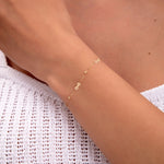 delicate gold plated bracelet with small infinity charms

