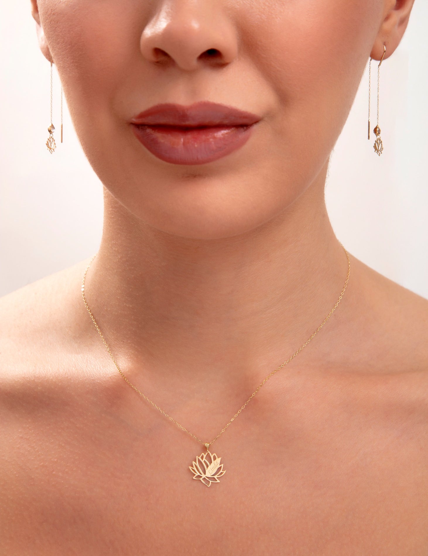 Model wearing a 14K gold plated lotus flower necklace with matching lotus threader earrings, spiritual minimalist jewelry set

