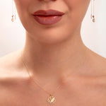 Model wearing a 14K gold plated lotus flower necklace with matching lotus threader earrings, spiritual minimalist jewelry set

