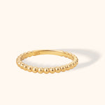 Minimal 14K gold beaded stacking ring with polished spherical design
