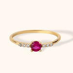 14K gold solitaire ring with round ruby center and small side diamonds