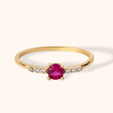 14K gold solitaire ring with round ruby center and small side diamonds