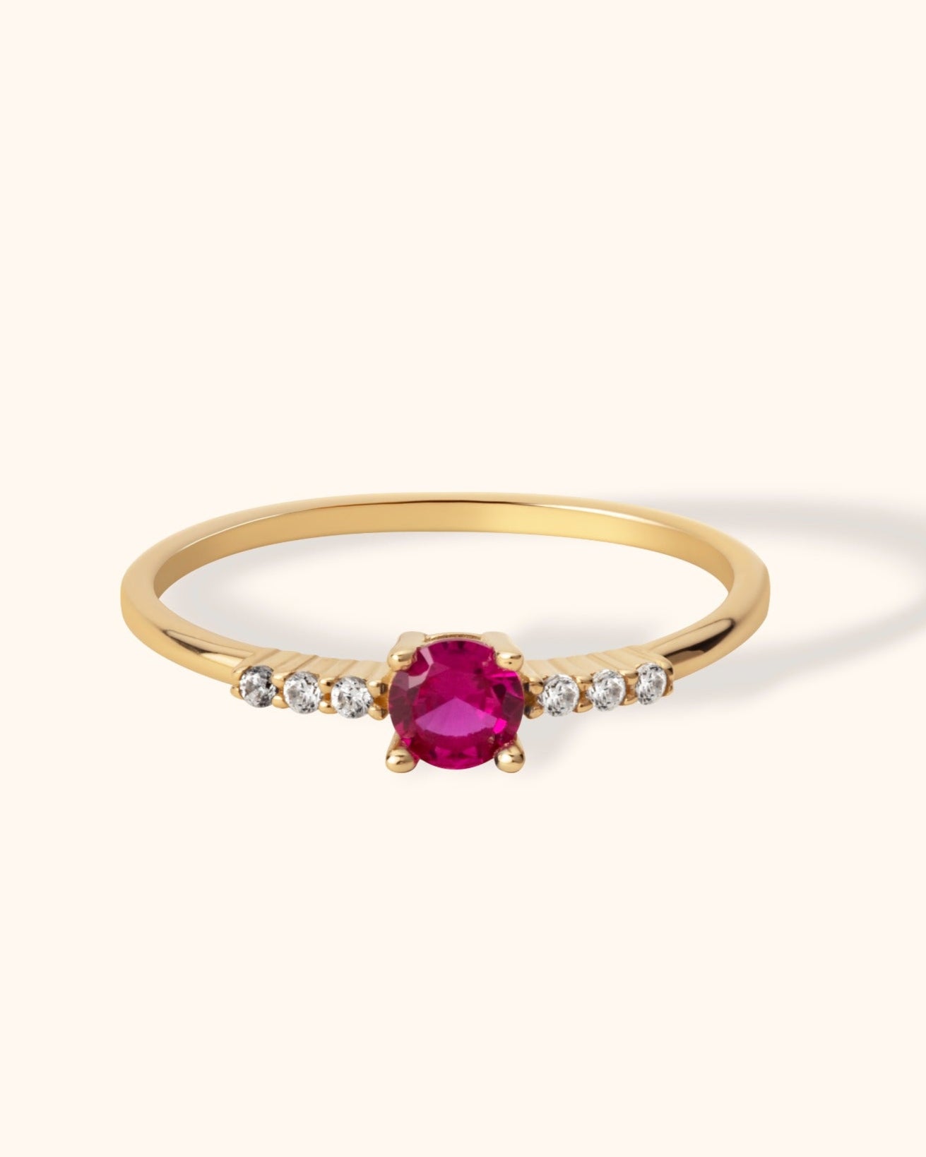 14K gold solitaire ring with round ruby center and small side diamonds